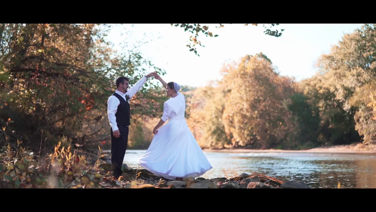 groom beside bride holding bouquet flowers