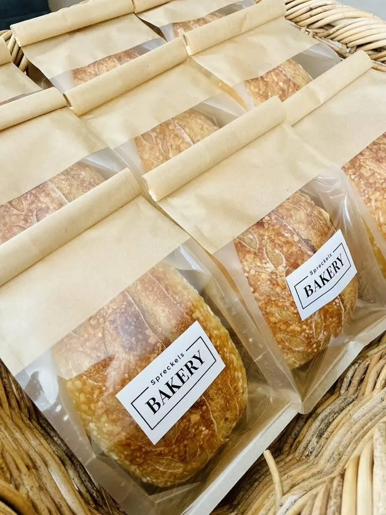 Loaves of Spreckels Bakery sourdough wrapped and ready for pickup