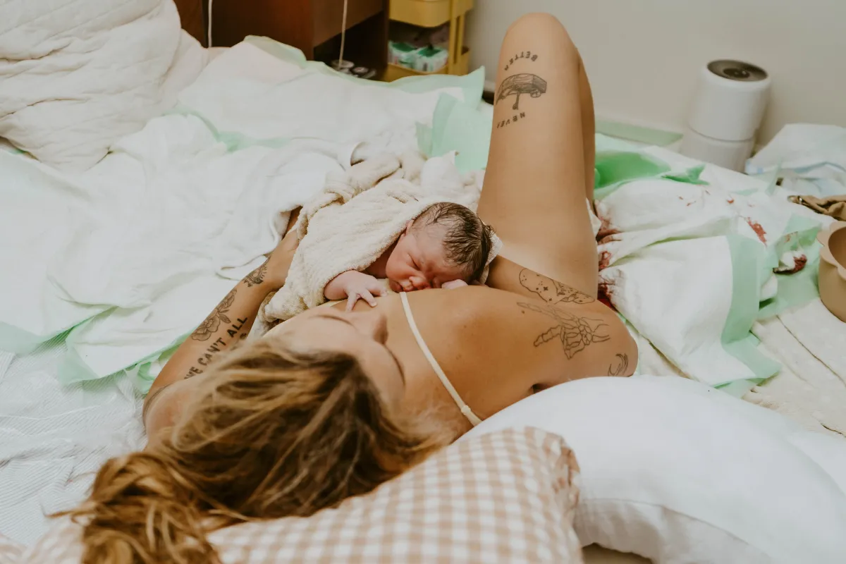 Newborn resting skin-to-skin on mother's chest after home birth