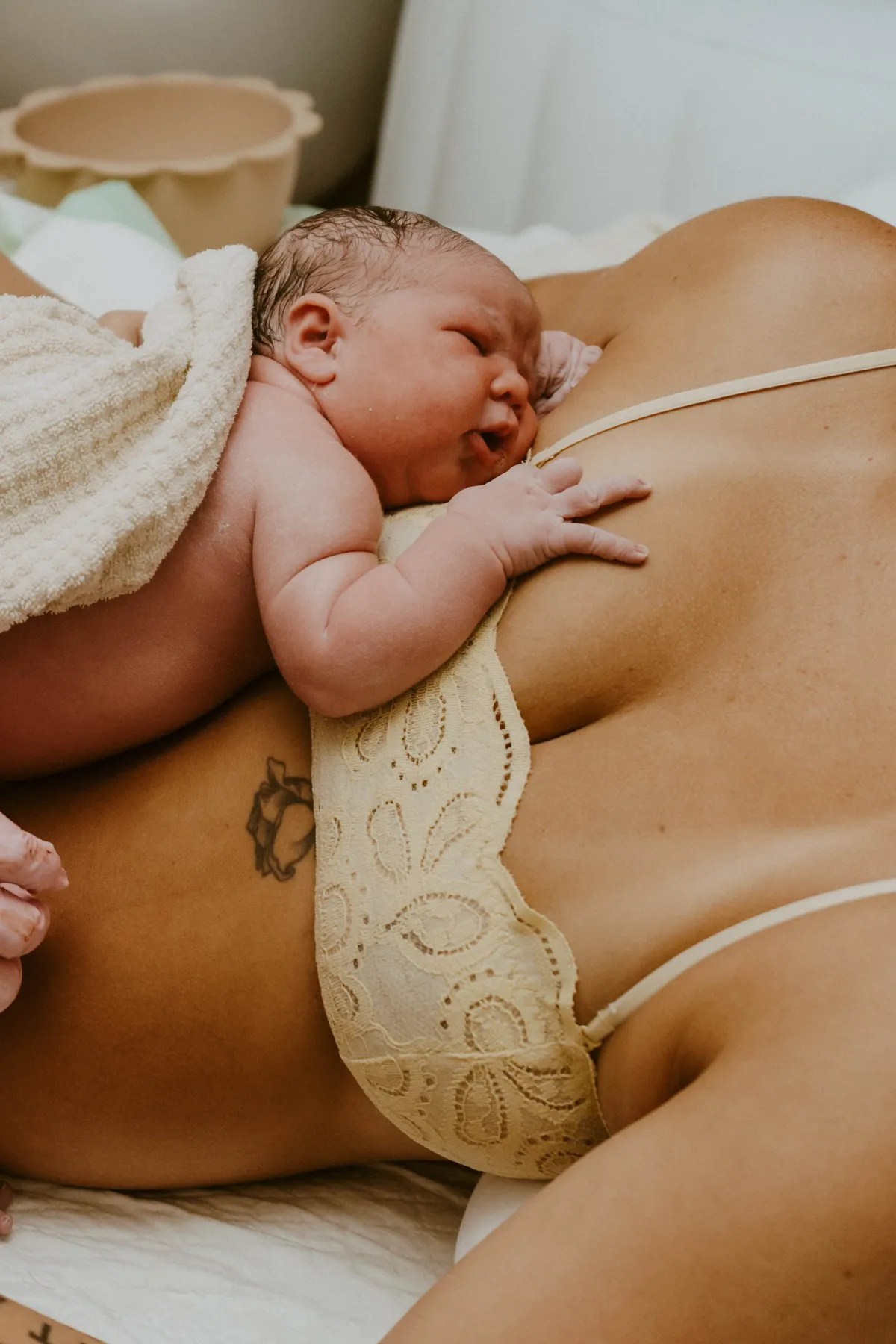 Newborn baby resting skin-to-skin on mother's chest