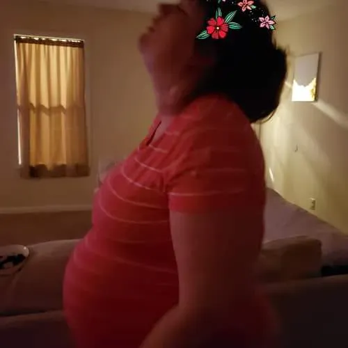 Pregnant woman during late pregnancy at home