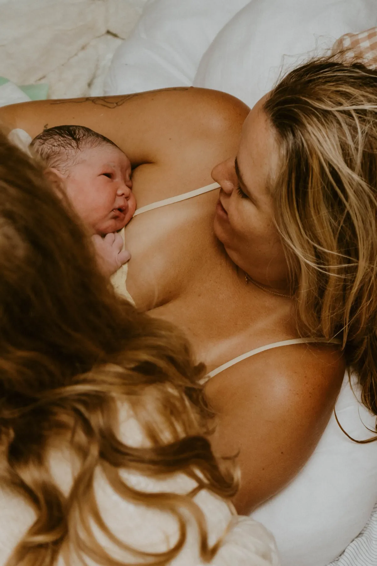 Mother bonding with her newborn immediately after home birth