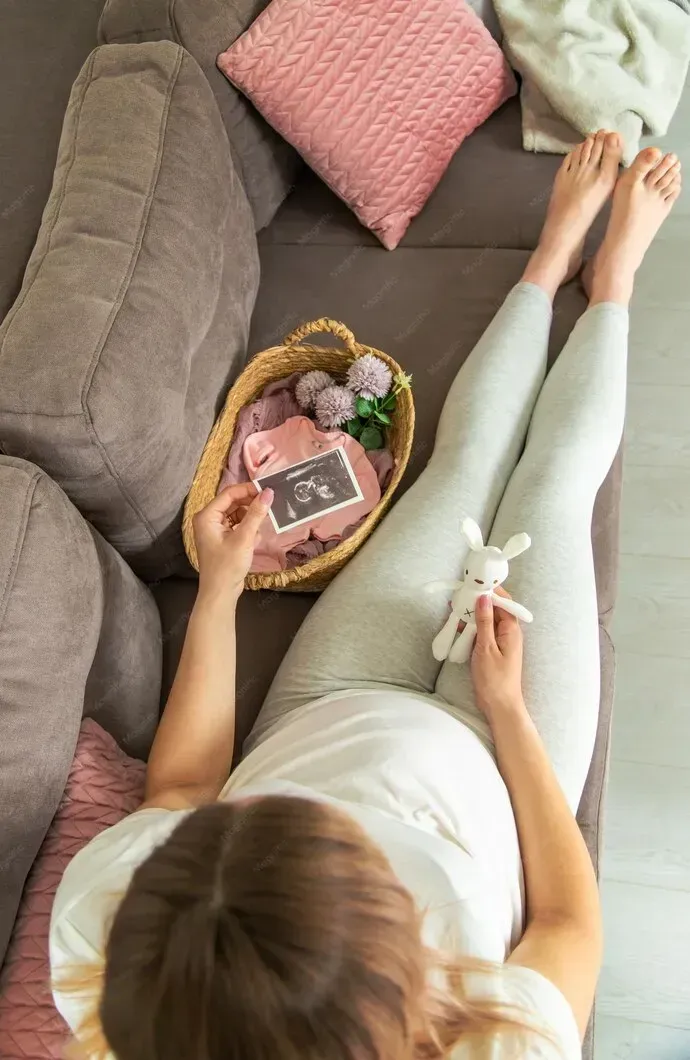 Pregnant woman preparing for home birth with ultrasound photo in Barnesville, GA