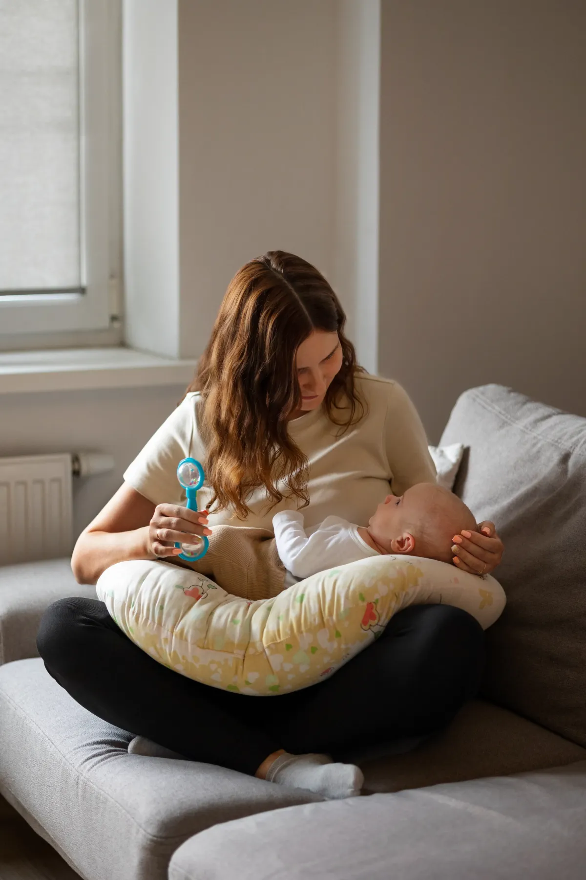 Mother caring for her newborn at home in Macon, GA