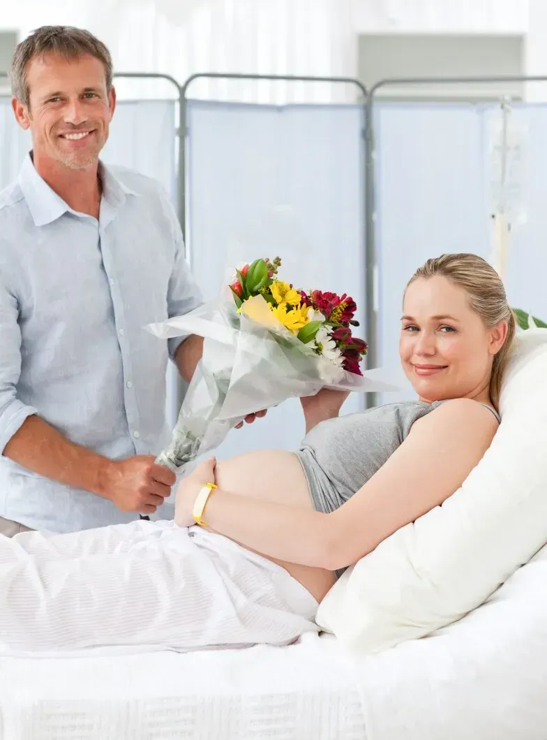 Pregnant woman receiving support from her partner while preparing for birth in Griffin, GA