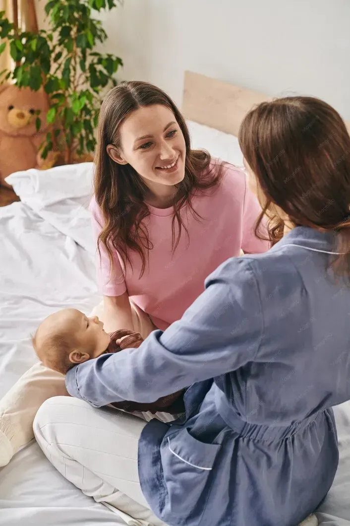 Mother holding her baby while receiving postpartum support in Warner Robins, GA
