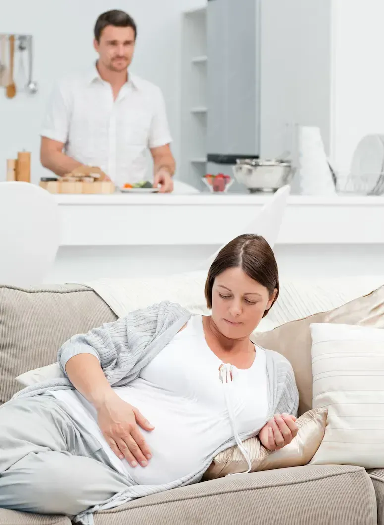 Pregnant woman preparing for home birth with partner support in Macon, GA