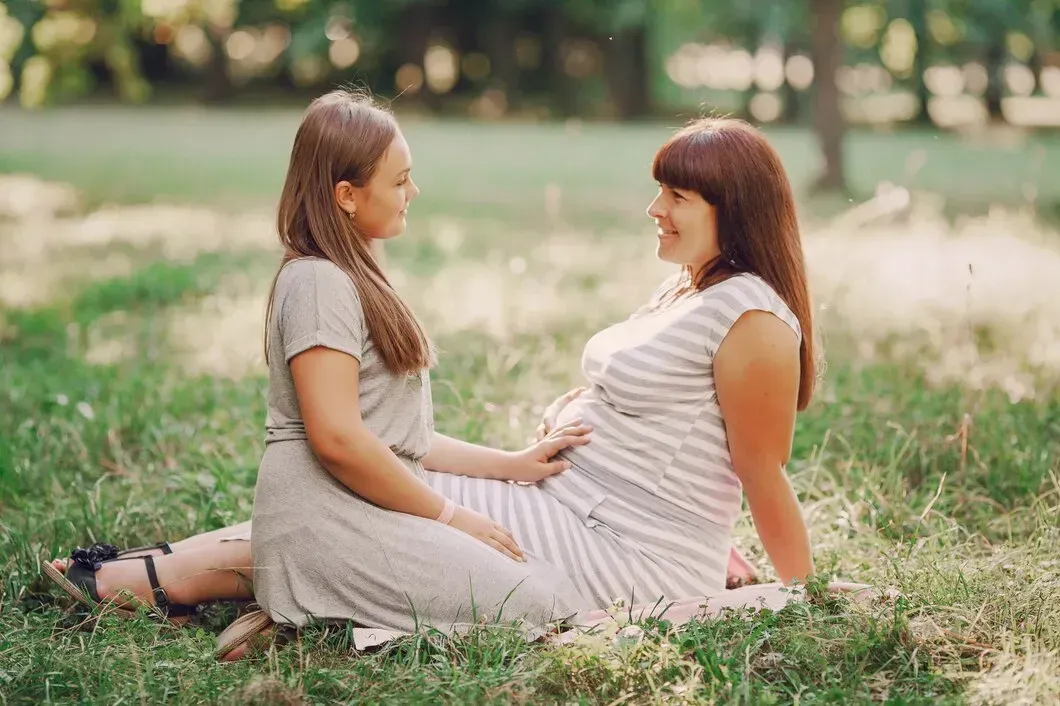 Pregnant woman receiving emotional support during holistic pregnancy care in Fayetteville, GA