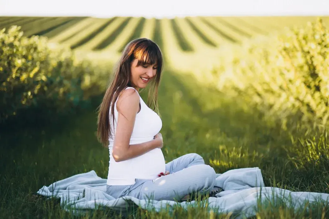 Pregnant mother practicing peaceful outdoor pregnancy wellness care in Zebulon, Georgia