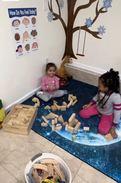 two kids playing with blocks