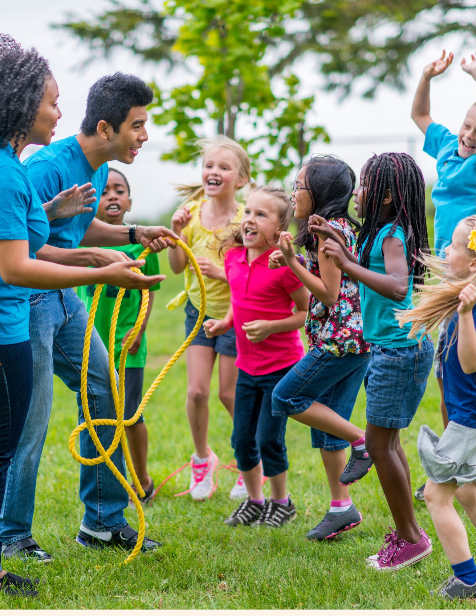 Girl folds paper while watching teacher on laptop