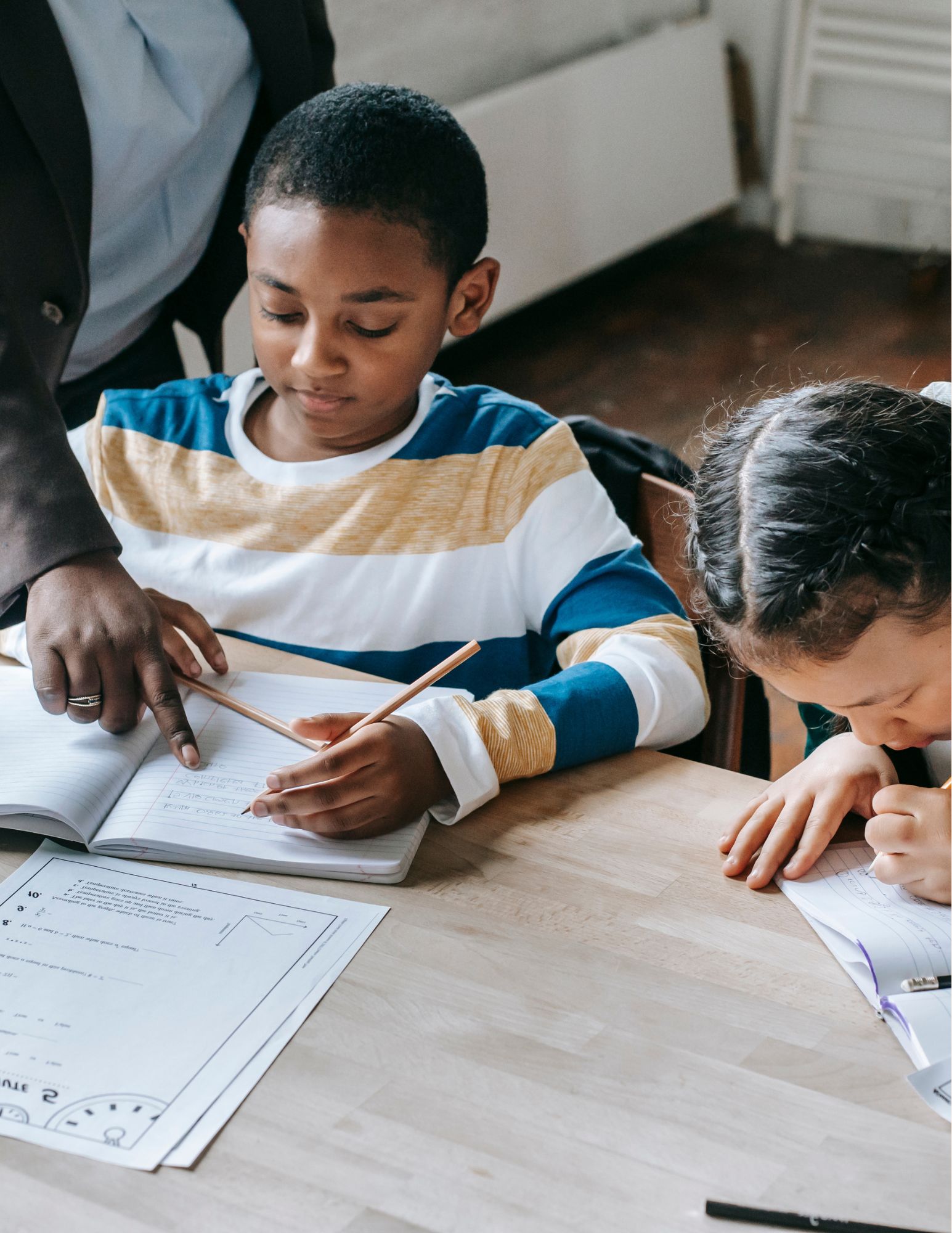 Kids moving with the teacher on a large screen TV