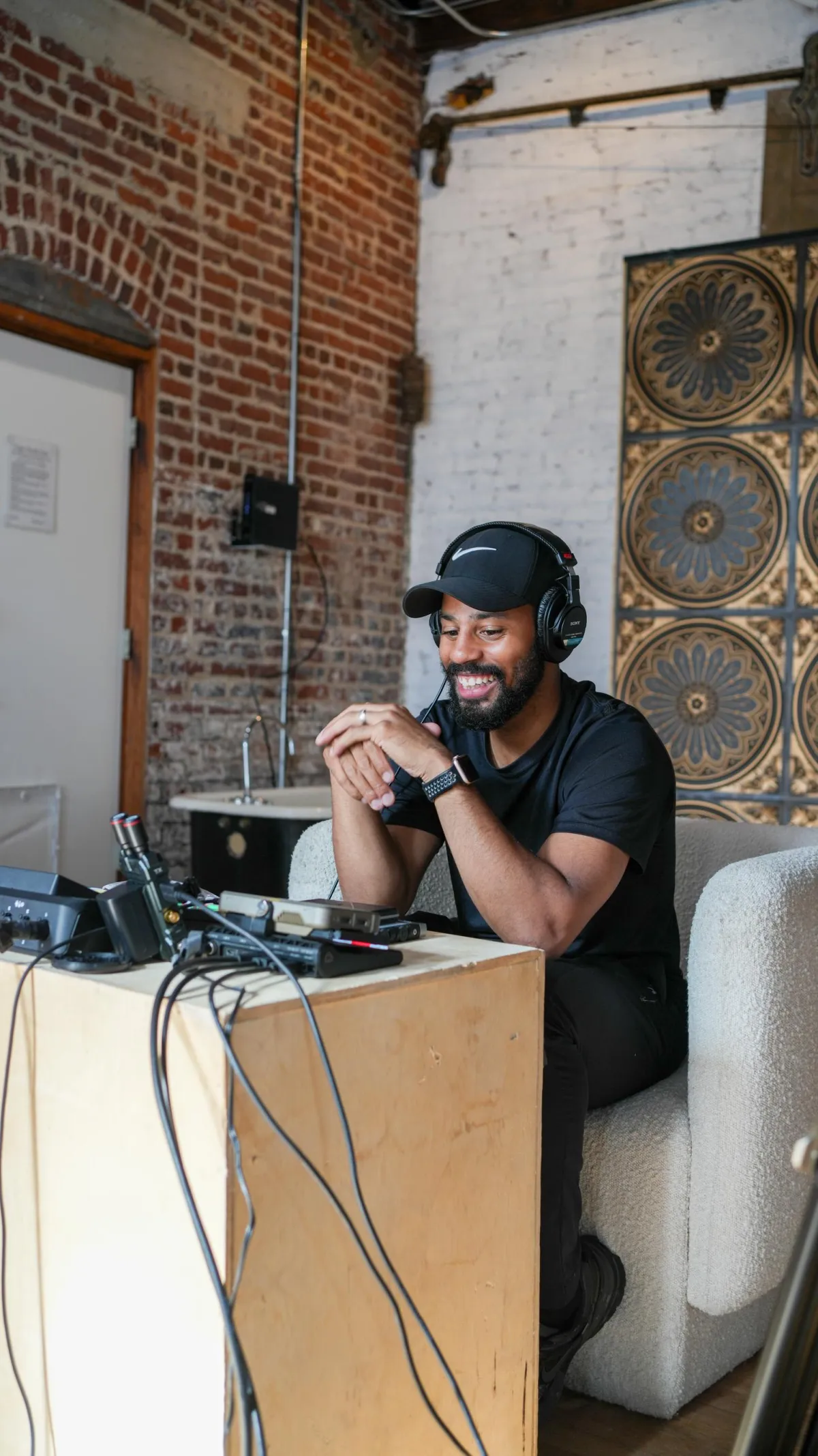 Photo of Ronzell replying to inquiries of clients.