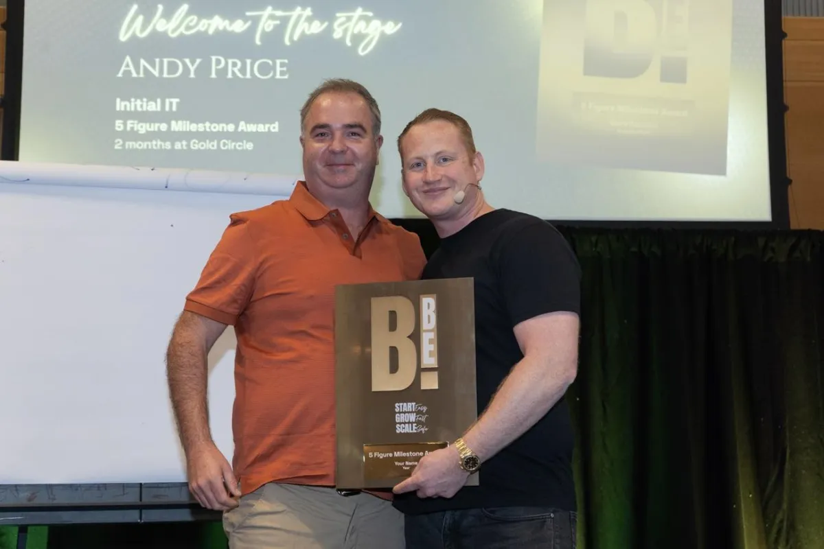 Andy Price 5 figure ilestone award with Adam Stott
