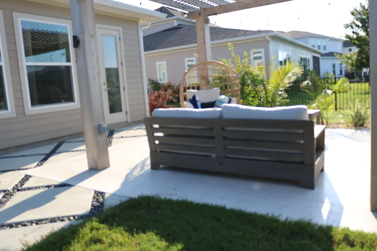 Buma Landscaping paved seating area beside the lawn