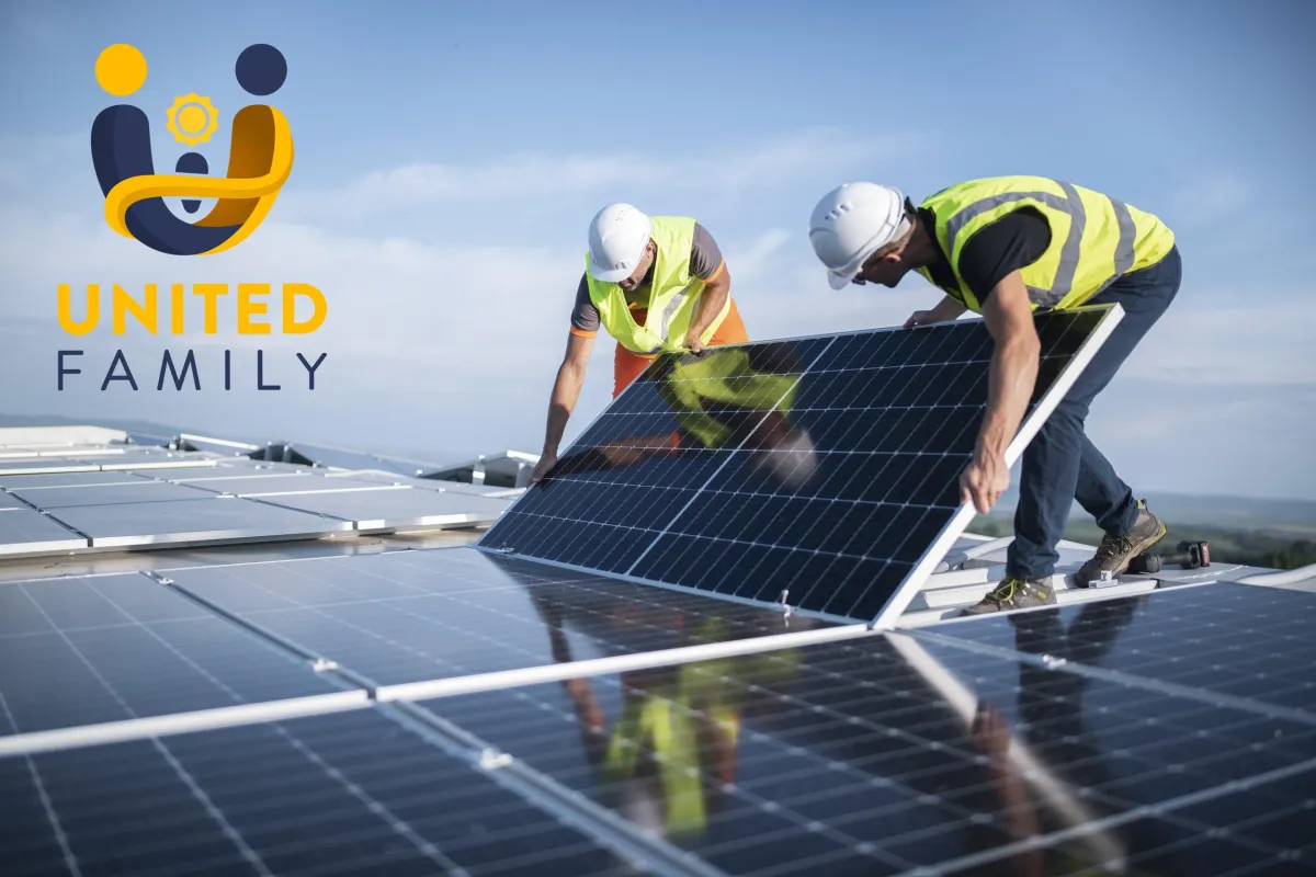 a couple of men working on a roof