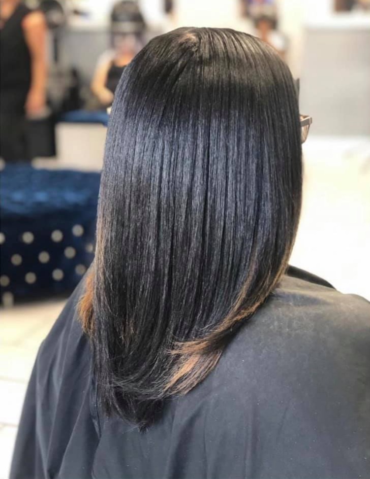 woman in white dress with white ribbon on head