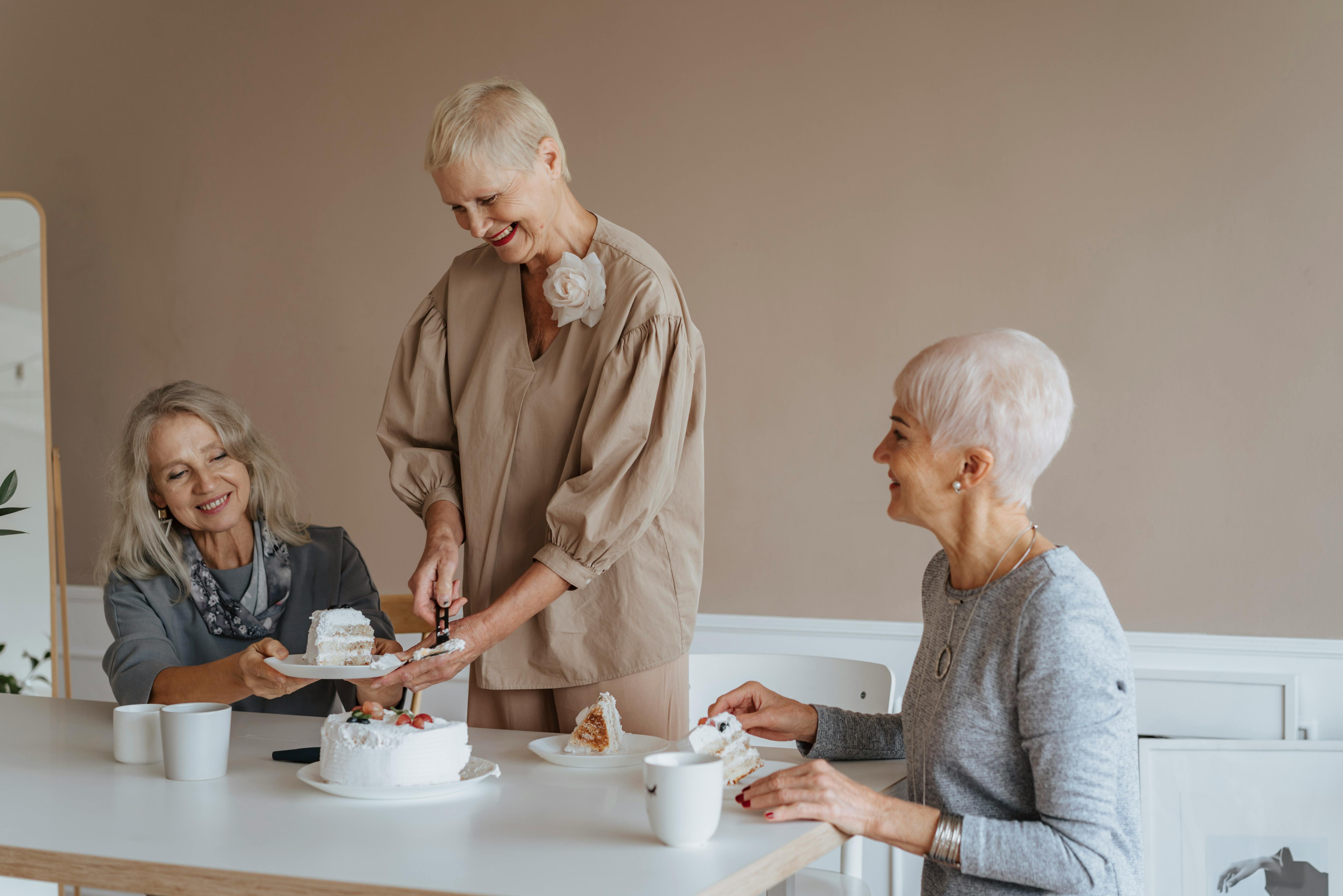 Group of senior women eating cake