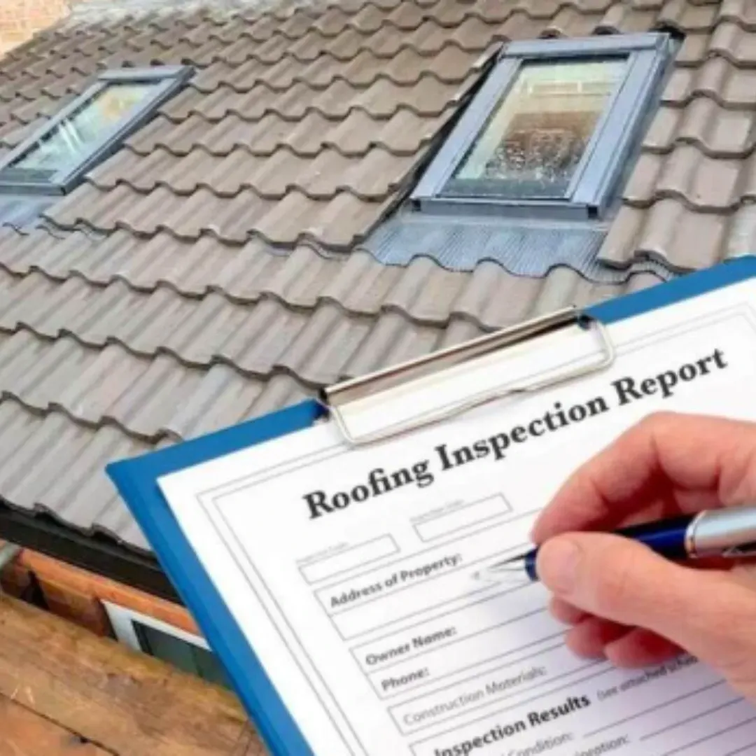 Roof inspection report being completed beside tile roof with skylights in Central Texas