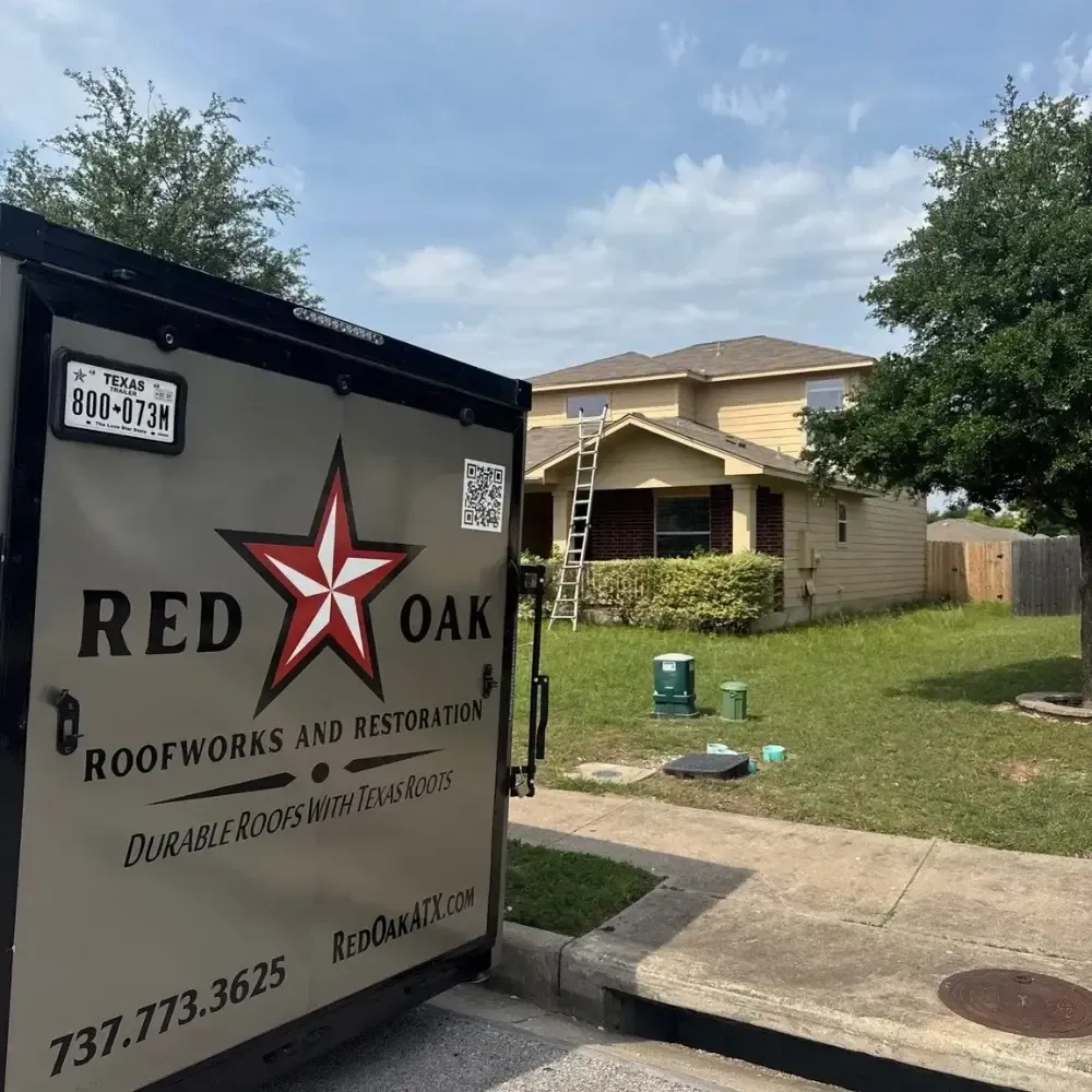 Red Oak Roofwork trailer outside Georgetown, TX home during roofing service project