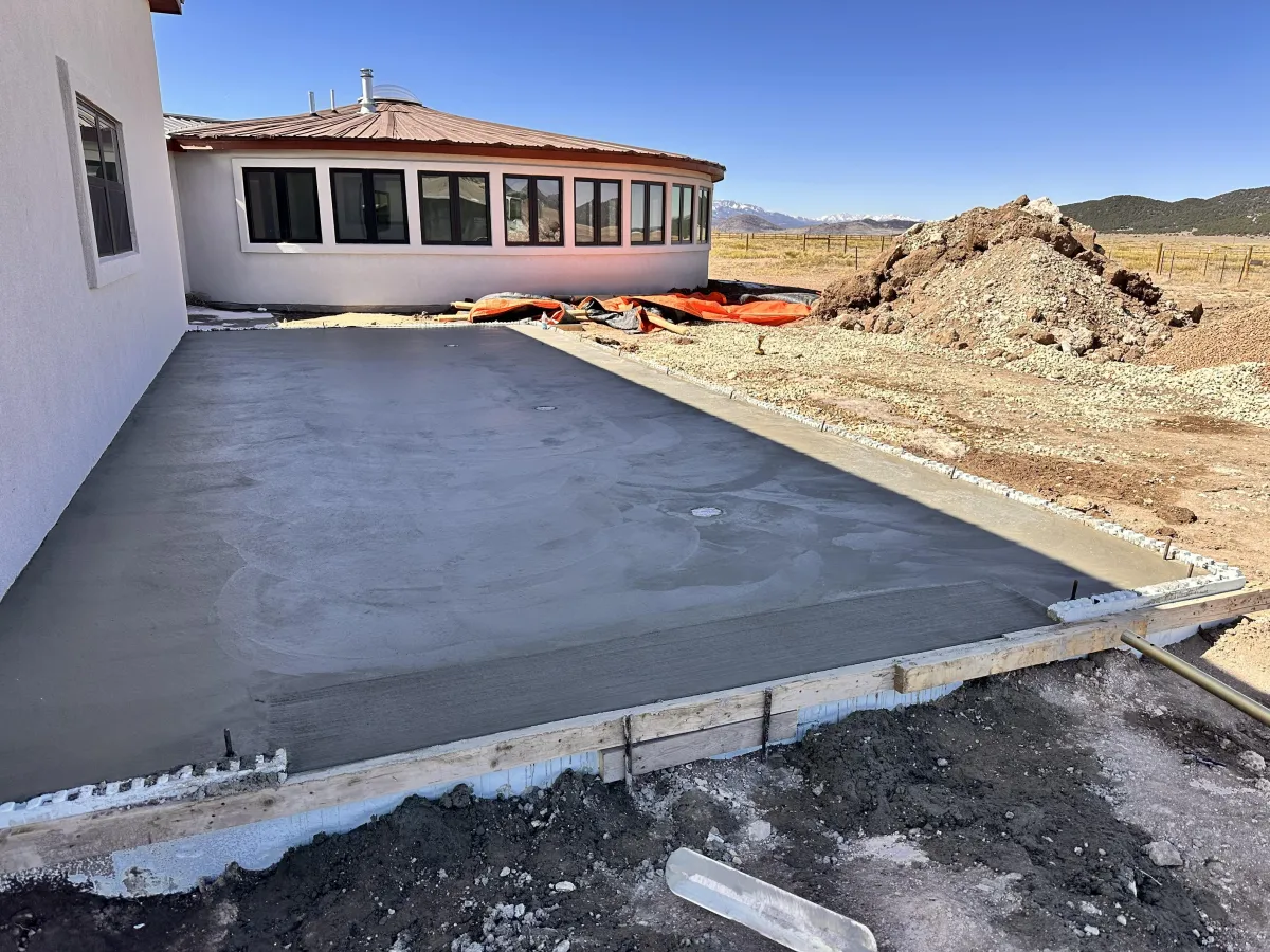 A dimly lit tunnel with railings and lights.