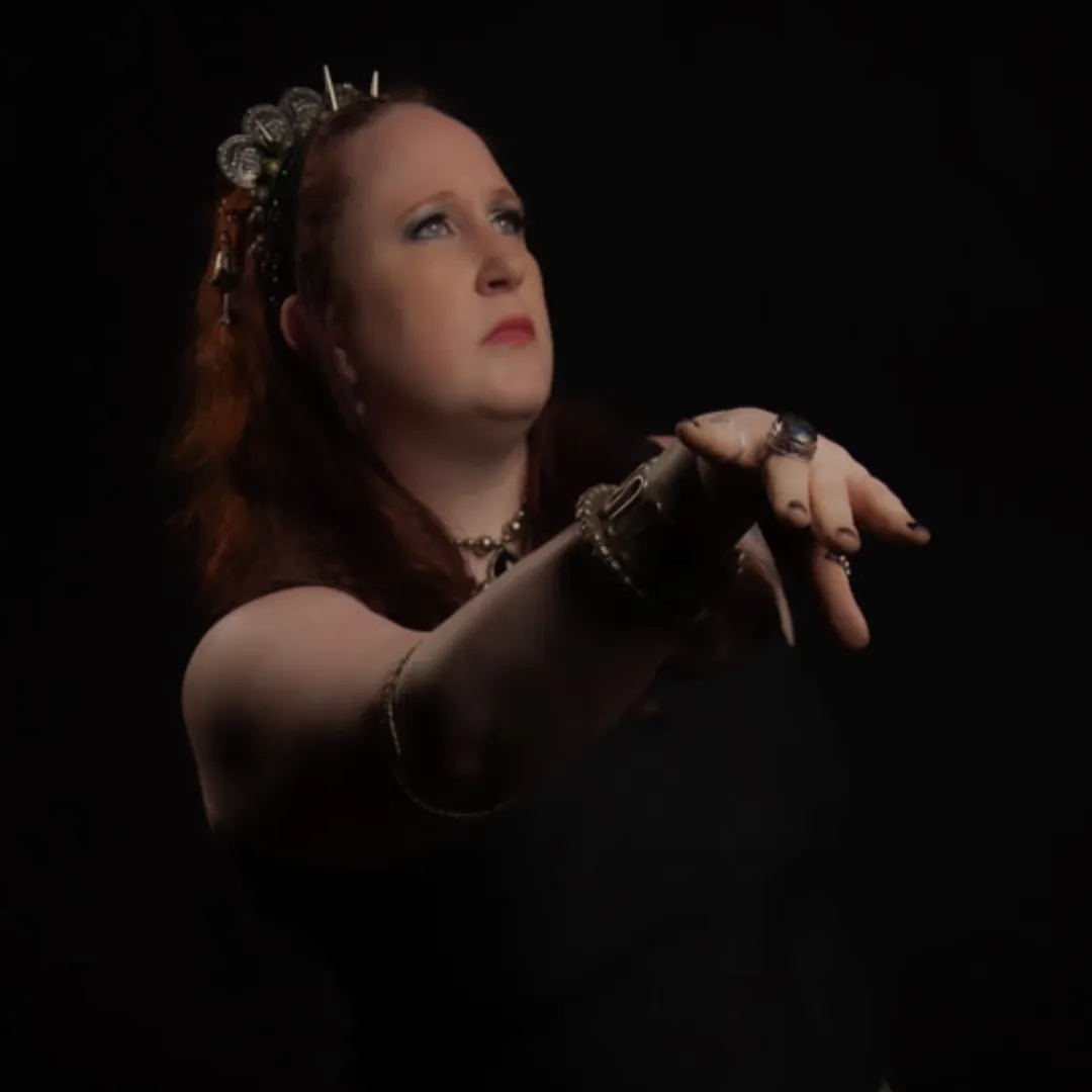 Kalistra dark fusion dancer in black costume reaching