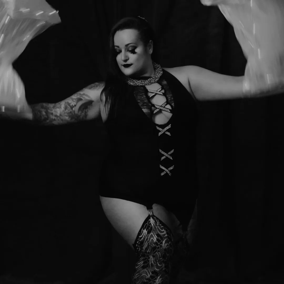 Sis Void dark fusion dancer with black costume and lace with silk veils