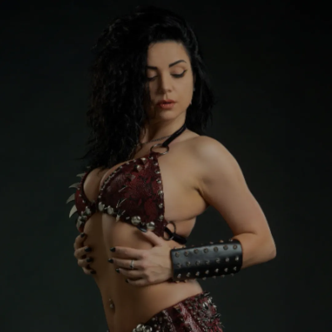 Diana Bastet metal belly dancer with red and black spiked costume