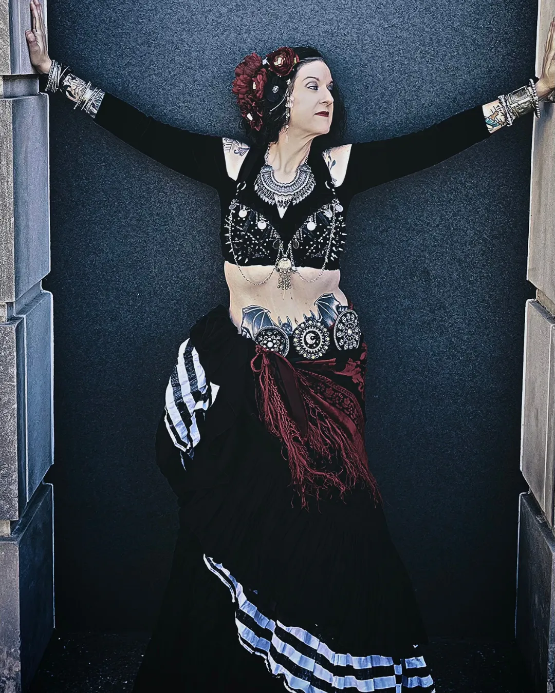 KP dancer from Nashville with long black skirt and red flowers