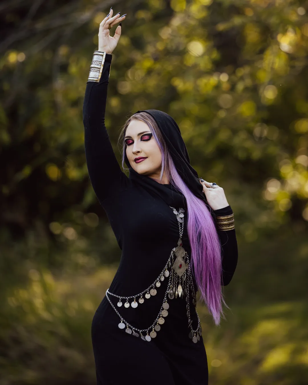 Izzy fusion belly dancer in black dress and body chain
