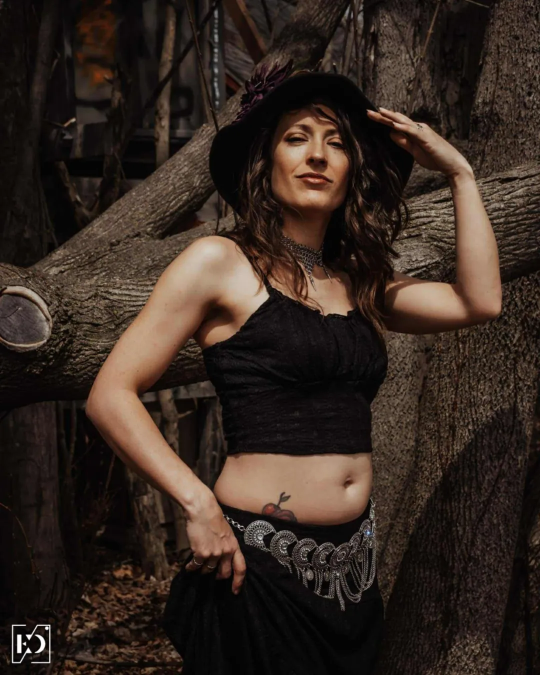 Mys Metalfusion dancer in black costume with metal accents and witch's hat