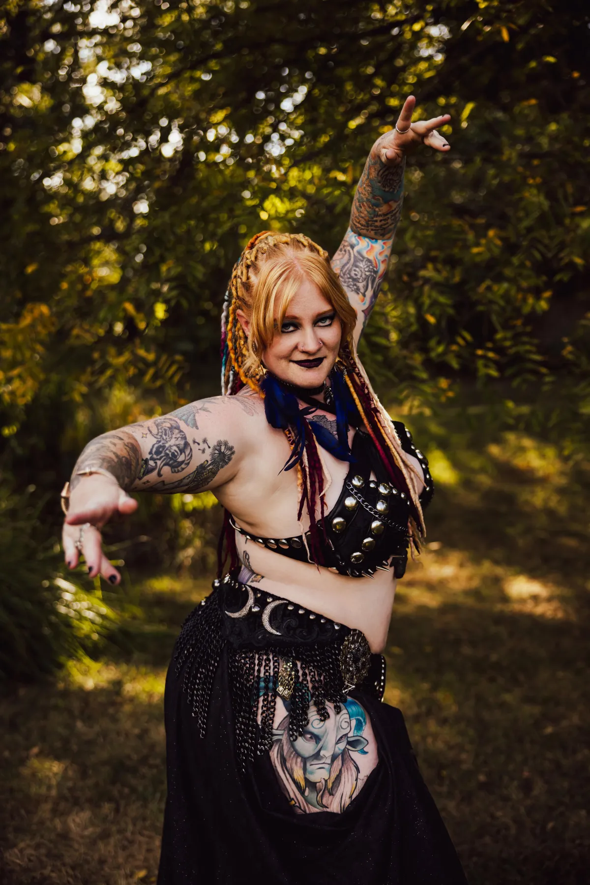 Daewen Gothic Dark Fusion outdoors with dreadlocks and tattoos