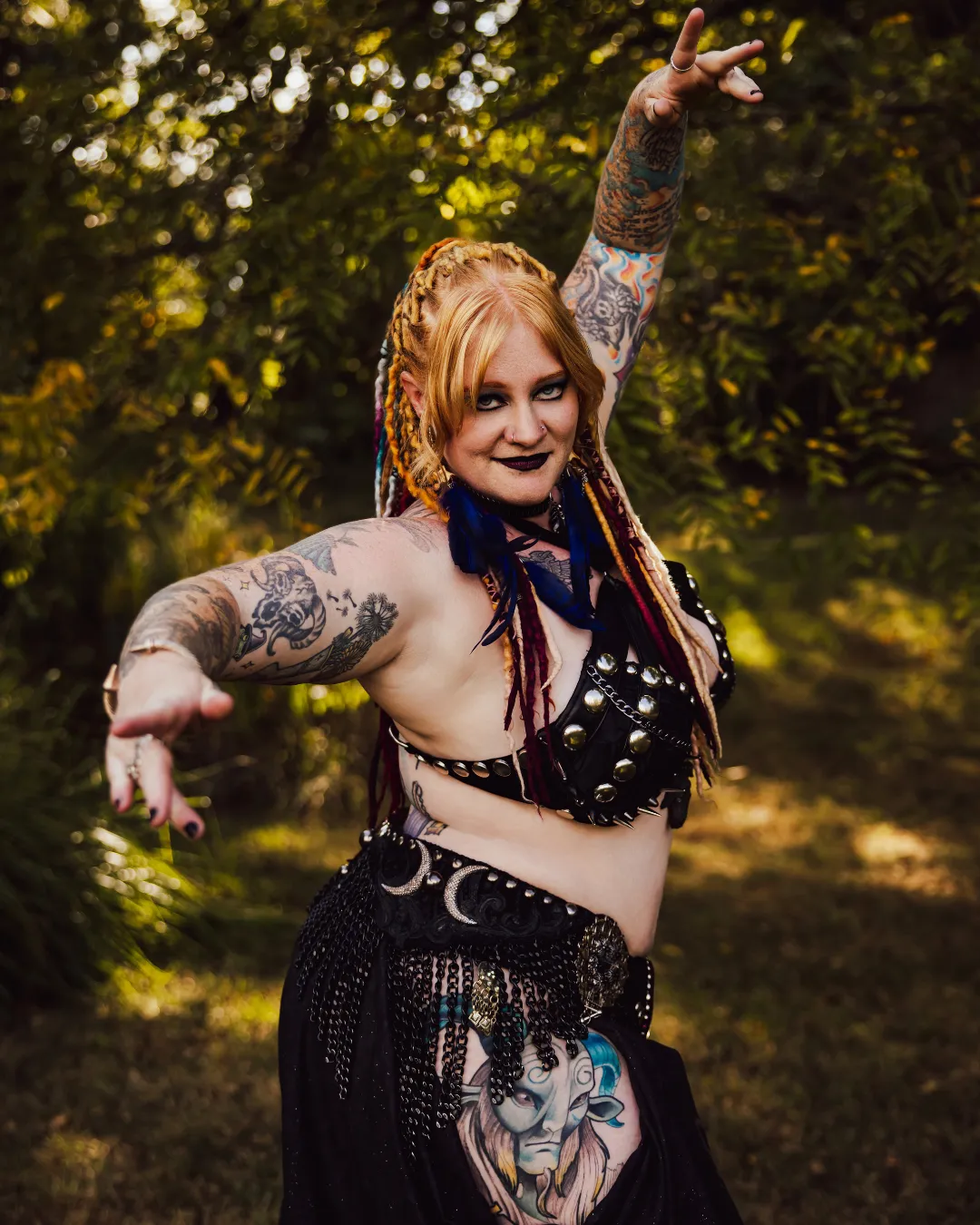 Daewen gothic pose outdoors with dreadlocks and tattoos