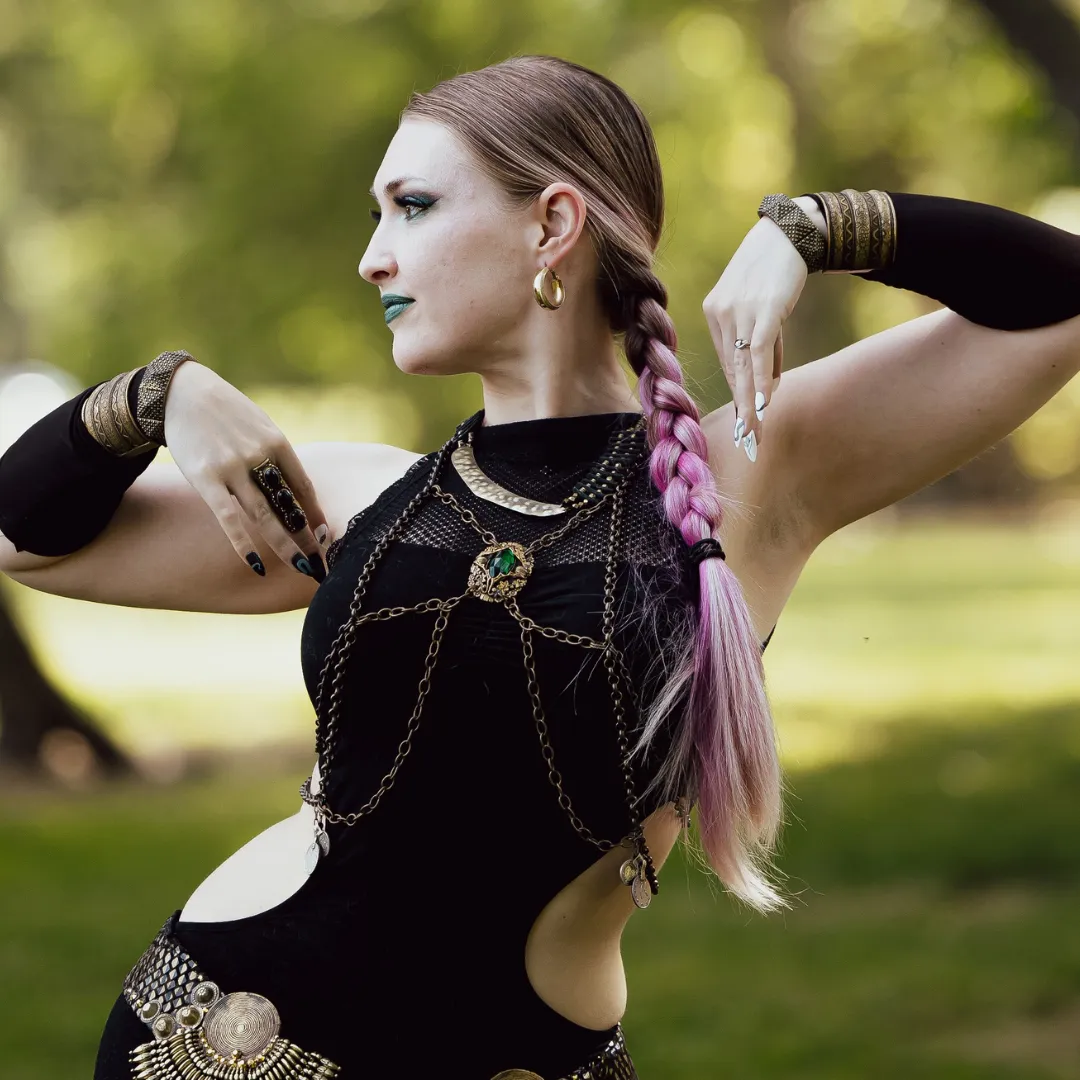 Izzy dark fusion dancer with black costume dress and braided hair
