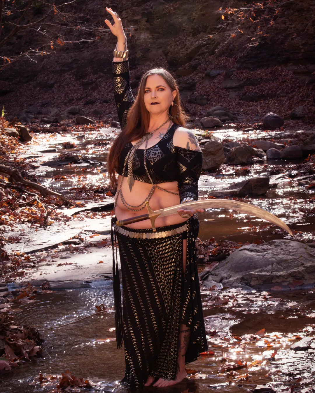Angie Never fusion belly dancer with sword in river