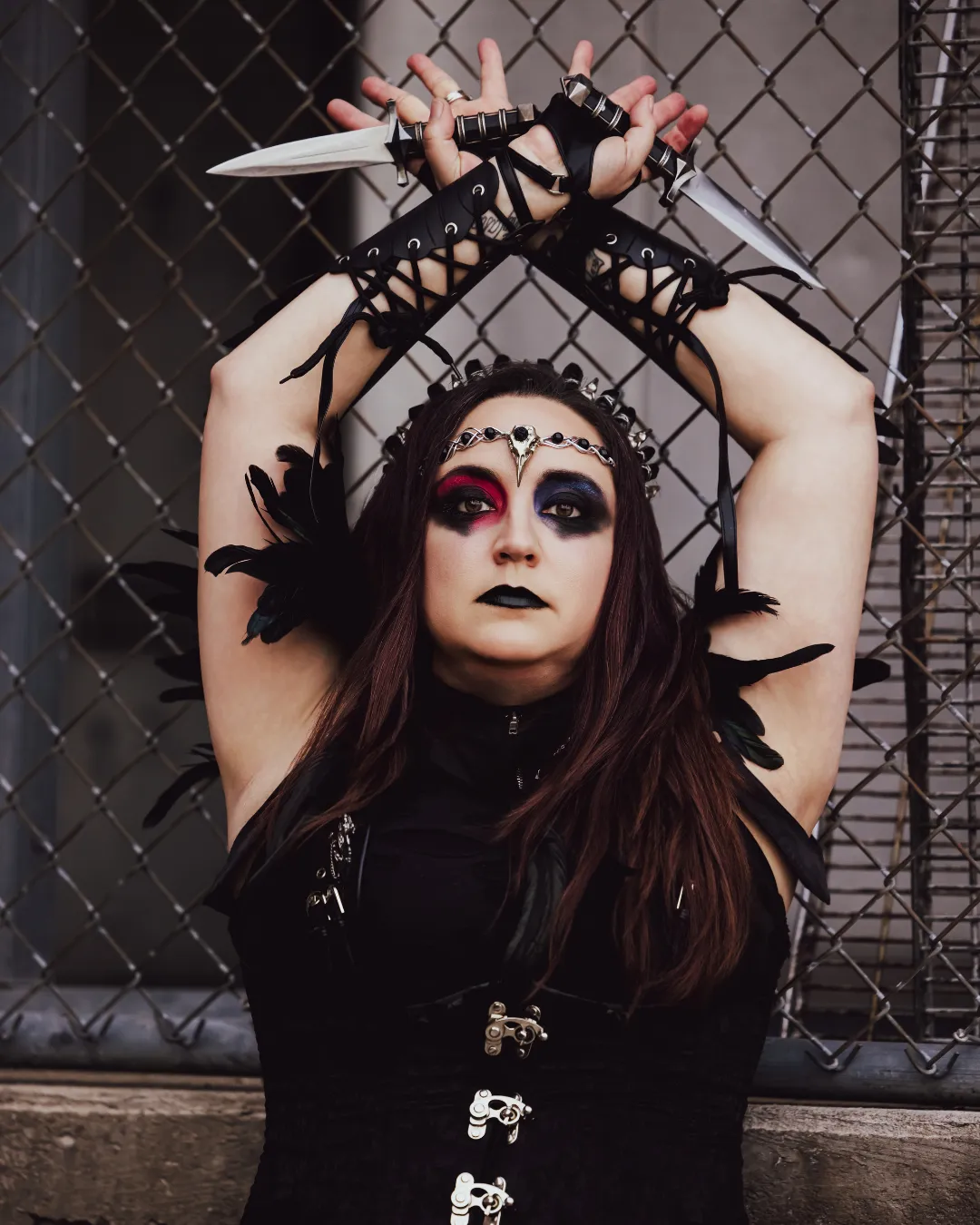 Ravynne fusion dancer with goth makeup daggers and corset