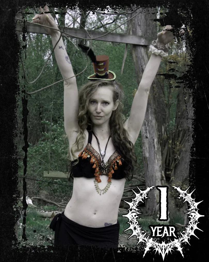 Sara Shewolf stretching up Mad Hatter costume
