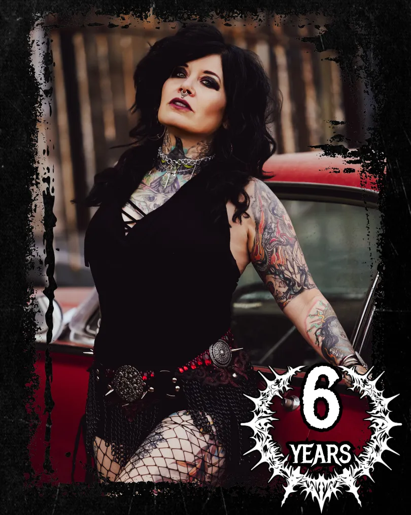 Ami Amoré pinup pose gothic dancer by red car