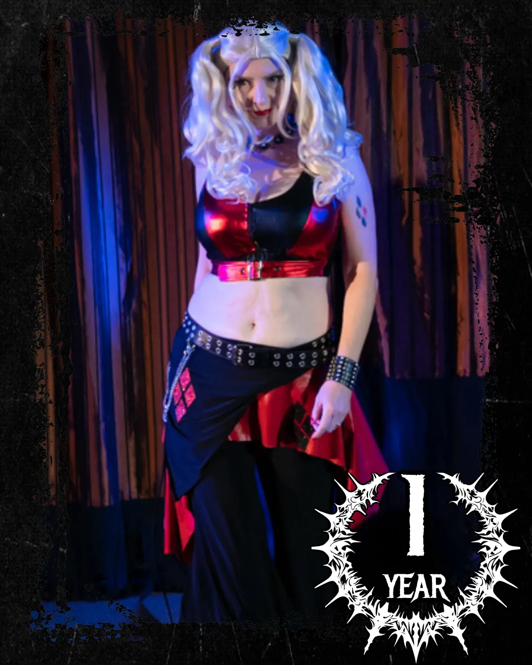 Deana performing as Harley Quinn in red and black costume