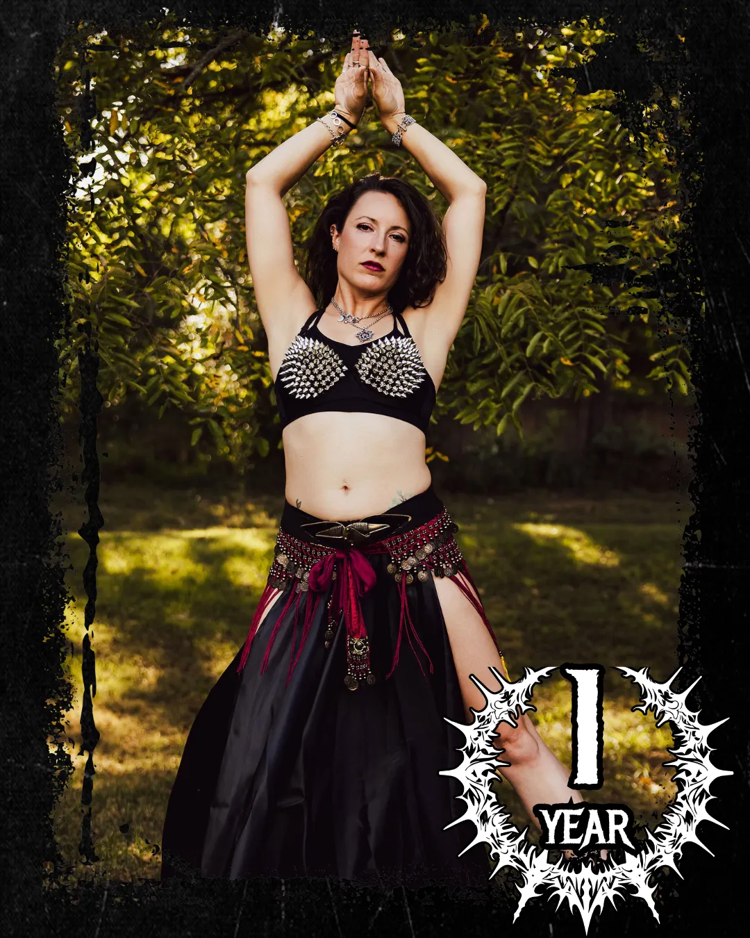 Mys Metal fusion dancer in black costume with spiked bra