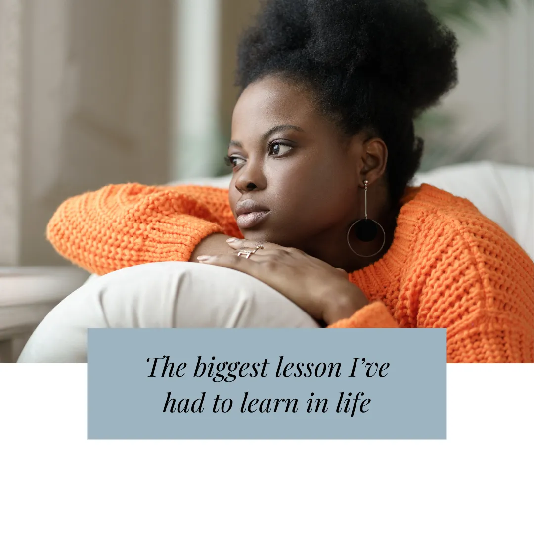 woman leaning on couch arm deep in thought