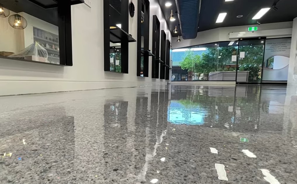 polished concrete flake floor with mirrors on its side