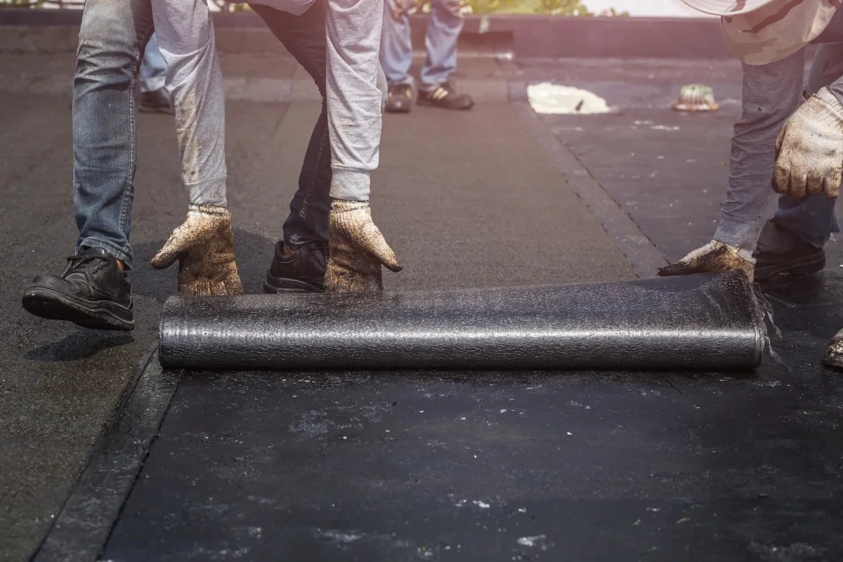 RoofNuts team repairing seams on EPDM roof in Florida