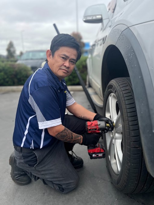 Portrait photo-style image of a single mobile tyre technician's work board and organized tyre-changing tools arranged neatly in a service van, isolated object on transparent background.