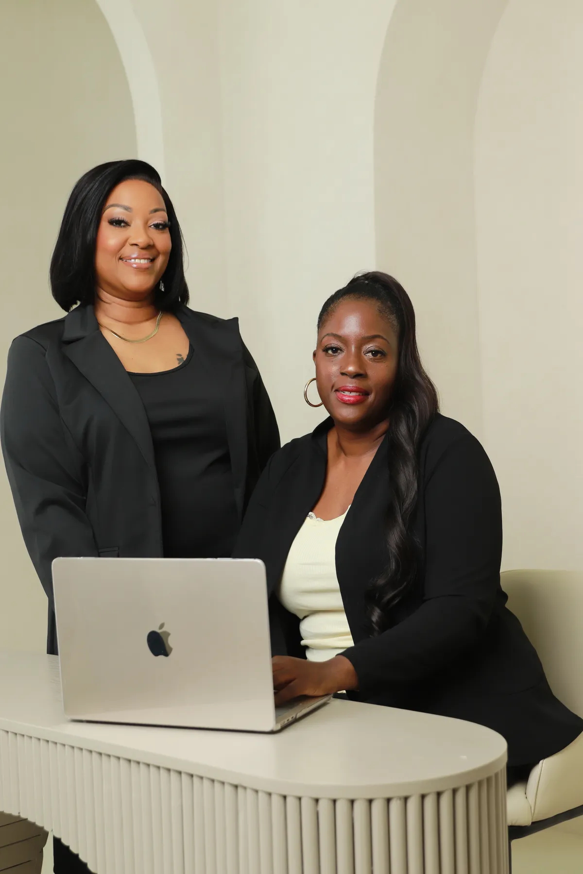 Confident Black woman CEO and entrepreneur working in a sophisticated sunlit boardroom office