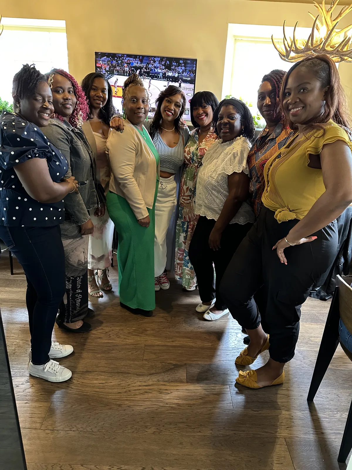 Black women entrepreneurs collaborating purposefully around an executive conference table