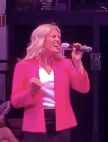 Aimee Geddes performing on stage