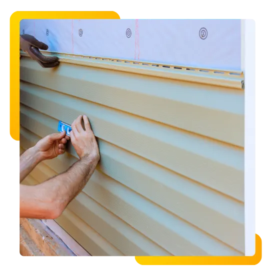 siding installer completing clean exterior finish 