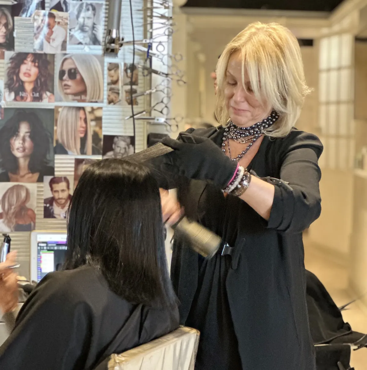 Professional hair color application technique demonstrated at Ida's Salon