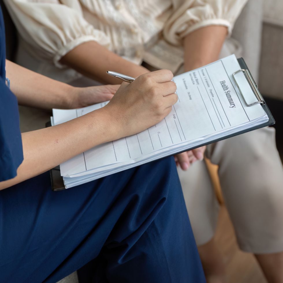 A patient reviewing their personalized health assessment with a functional medicine practitioner at Solutions Functional Medicine Centre